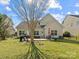 Spacious backyard featuring a patio with dining area and grill, perfect for outdoor entertaining at 13510 Brandon Trail Dr, Charlotte, NC 28213