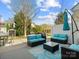 Backyard patio with comfortable seating, outdoor umbrella, and a cozy setting for outdoor relaxation at 13510 Brandon Trail Dr, Charlotte, NC 28213