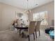 Cozy dining room with a chandelier, perfect for Gathering dinners and entertaining guests at 13510 Brandon Trail Dr, Charlotte, NC 28213
