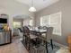 Open-concept dining area with a view into the living room, perfect for Gathering meals at 13510 Brandon Trail Dr, Charlotte, NC 28213