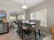 Open-concept dining area with a view into the living room, perfect for Gathering meals at 13510 Brandon Trail Dr, Charlotte, NC 28213