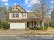 Charming two-story home with a manicured lawn and a two-car garage, perfect for suburban living at 13510 Brandon Trail Dr, Charlotte, NC 28213