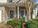 Charming front porch with stone accents, creating a welcoming entrance to the home at 13510 Brandon Trail Dr, Charlotte, NC 28213