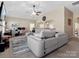 Open living space with vaulted ceilings, a large sectional sofa, and seamless transition to the kitchen at 13510 Brandon Trail Dr, Charlotte, NC 28213