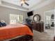 Spacious main bedroom with a ceiling fan, sitting area and a flat screen TV at 13510 Brandon Trail Dr, Charlotte, NC 28213