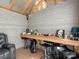 Finished shed interior with bar seating, perfect for a game room or entertaining space at 13510 Brandon Trail Dr, Charlotte, NC 28213