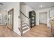Welcoming entryway with hardwood floors and staircase leading to the upper level at 13709 Roderick Dr # 193, Huntersville, NC 28078