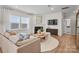 Cozy living room with a fireplace, neutral furnishings, and ample natural light at 13709 Roderick Dr # 193, Huntersville, NC 28078