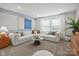 Bright and airy living room with comfortable seating, and a neutral color palette at 13709 Roderick Dr # 193, Huntersville, NC 28078