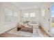 Bright living room with natural light, a comfortable sofa, area rug and stylish coffee table at 13709 Roderick Dr # 193, Huntersville, NC 28078