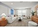 Cozy living room featuring a large comfortable sofa, and bright natural light at 13709 Roderick Dr # 193, Huntersville, NC 28078