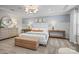 This primary bedroom features tray ceilings, an accent wall, neutral paint, carpet, and contemporary furnishings at 13709 Roderick Dr # 193, Huntersville, NC 28078