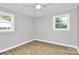 Bright, empty bedroom featuring wood-look vinyl flooring and two windows at 140 Mickle Ct, Rock Hill, SC 29732