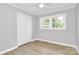 Neutral bedroom with wood floors, large closet, and natural light at 140 Mickle Ct, Rock Hill, SC 29732