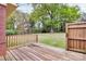 Wooden deck with a view of the grassy yard, trees, and partial red brick home at 140 Mickle Ct, Rock Hill, SC 29732
