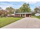 Well-manicured lawn and a charming brick home featuring a long driveway leading up to the house at 140 Mickle Ct, Rock Hill, SC 29732