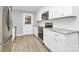 Updated kitchen featuring white cabinets, stainless steel appliances, and granite countertops at 140 Mickle Ct, Rock Hill, SC 29732