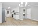 Bright eat-in kitchen featuring white cabinets, stainless steel appliances, and modern lighting at 140 Mickle Ct, Rock Hill, SC 29732