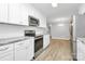 Bright kitchen featuring stainless steel appliances and granite countertops open to the dining room at 140 Mickle Ct, Rock Hill, SC 29732