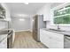 Updated eat-in kitchen with stainless steel appliances next to the dining room at 140 Mickle Ct, Rock Hill, SC 29732