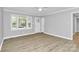Living room showcasing wood floors, grey walls, neutral decor, and natural light at 140 Mickle Ct, Rock Hill, SC 29732