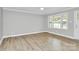 Living room features wood floors, grey walls, neutral decor, large windows and natural light at 140 Mickle Ct, Rock Hill, SC 29732