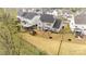 A bird's-eye view highlights the property's backyard, playset, and proximity to neighboring homes at 15230 Ravenall Dr, Huntersville, NC 28078