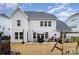 Spacious backyard featuring a patio area and a swing set perfect for outdoor enjoyment at 15230 Ravenall Dr, Huntersville, NC 28078