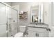 Well-lit bathroom featuring a glass shower, granite countertop, and modern fixtures at 15230 Ravenall Dr, Huntersville, NC 28078
