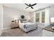 Bright bedroom with a modern ceiling fan, window, and neutral-toned decor at 15230 Ravenall Dr, Huntersville, NC 28078