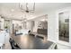 Open floorplan showcases modern dining area with an eat-in kitchen and sun-drenched living area at 15230 Ravenall Dr, Huntersville, NC 28078