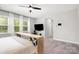 Bright main bedroom featuring light walls, carpet, and natural light from large windows at 15230 Ravenall Dr, Huntersville, NC 28078