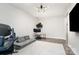 Bright home office with dual monitors, couch, and desk space at 15230 Ravenall Dr, Huntersville, NC 28078
