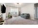 Bright playroom with comfortable seating, a toy kitchen, and natural lighting at 15230 Ravenall Dr, Huntersville, NC 28078