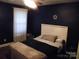 Inviting bedroom showcasing natural light, complemented by minimalist decor and cozy furnishings at 154 Tiger Oak Ln, Rockwell, NC 28138