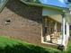 Inviting brick home featuring a charming front porch with classic rocking chairs and white columns at 154 Tiger Oak Ln, Rockwell, NC 28138