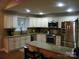 Modern kitchen featuring stainless appliances, granite counters, and ample cabinet space, great for cooking at 154 Tiger Oak Ln, Rockwell, NC 28138