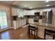 The kitchen features white cabinets, stainless steel appliances, and granite countertops at 154 Tiger Oak Ln, Rockwell, NC 28138