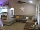 Open-concept living room featuring hardwood floors, a neutral palette, and views into the kitchen at 154 Tiger Oak Ln, Rockwell, NC 28138