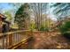 Spacious backyard featuring a wooden deck and mature trees at 1713 12Th Ne St, Hickory, NC 28601