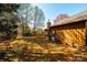 An angle shot of the backyard and side exterior of the house, showing its serene outdoor space at 1713 12Th Ne St, Hickory, NC 28601