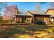A backyard featuring a wooden deck and a glimpse of the home's exterior against a clear blue sky at 1713 12Th Ne St, Hickory, NC 28601