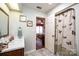 Bright bathroom adjacent to the bedroom, featuring a charming butterfly themed shower curtain at 1713 12Th Ne St, Hickory, NC 28601