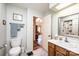 Well-lit bathroom with skylight, complementing the neutral color scheme and open doorway at 1713 12Th Ne St, Hickory, NC 28601