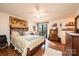 Cozy bedroom with wood floors and a sliding glass door leading to a deck at 1713 12Th Ne St, Hickory, NC 28601