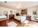 Inviting bedroom with hardwood floors, filled with natural light from the large window at 1713 12Th Ne St, Hickory, NC 28601