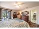 Bright bedroom with wood floors, dresser, and ensuite bathroom at 1713 12Th Ne St, Hickory, NC 28601