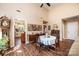 Dining area with vaulted ceiling, hardwood floors, access to kitchen, and modern décor at 1713 12Th Ne St, Hickory, NC 28601
