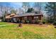 An exterior view of a home with lush greenery, highlighting its charming curb appeal at 1713 12Th Ne St, Hickory, NC 28601