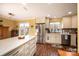Bright kitchen features stainless steel appliances, white cabinets, and a large island at 1713 12Th Ne St, Hickory, NC 28601